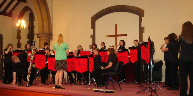 Present members performing at the concert